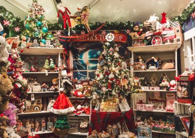 children's themed room with stocking stuffers, stuffed animals and more inside the seasonal shopping experience