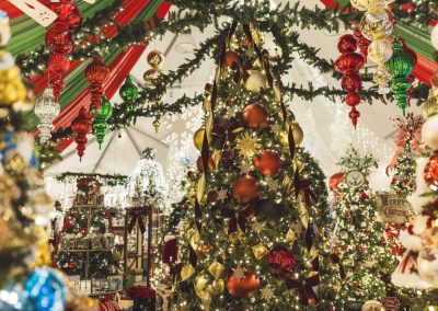 decorated trees with ribbon, garland and other accents in the Seasonal Shopping Experience